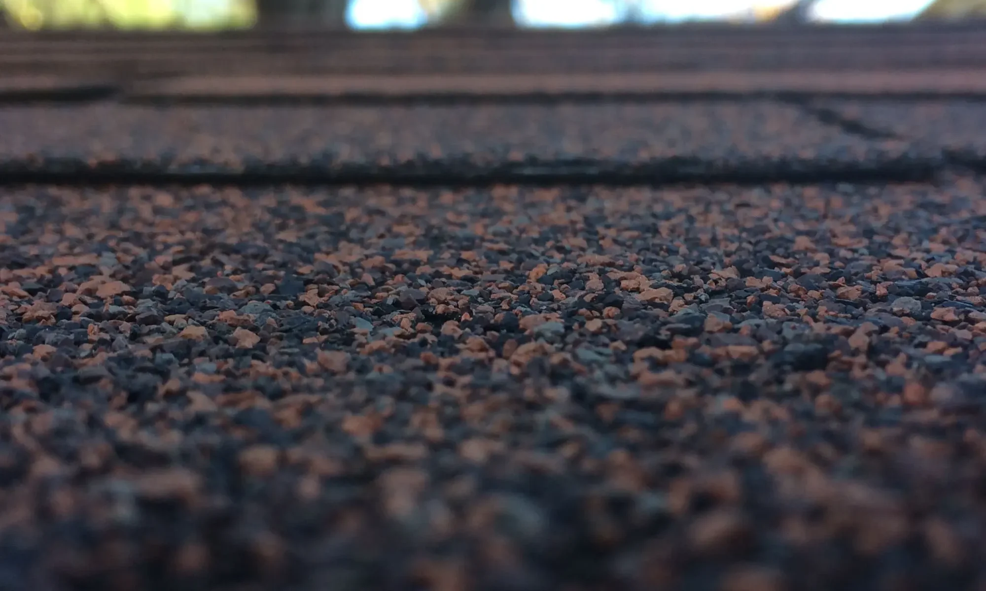 Close up of asphalt roof shingle granules