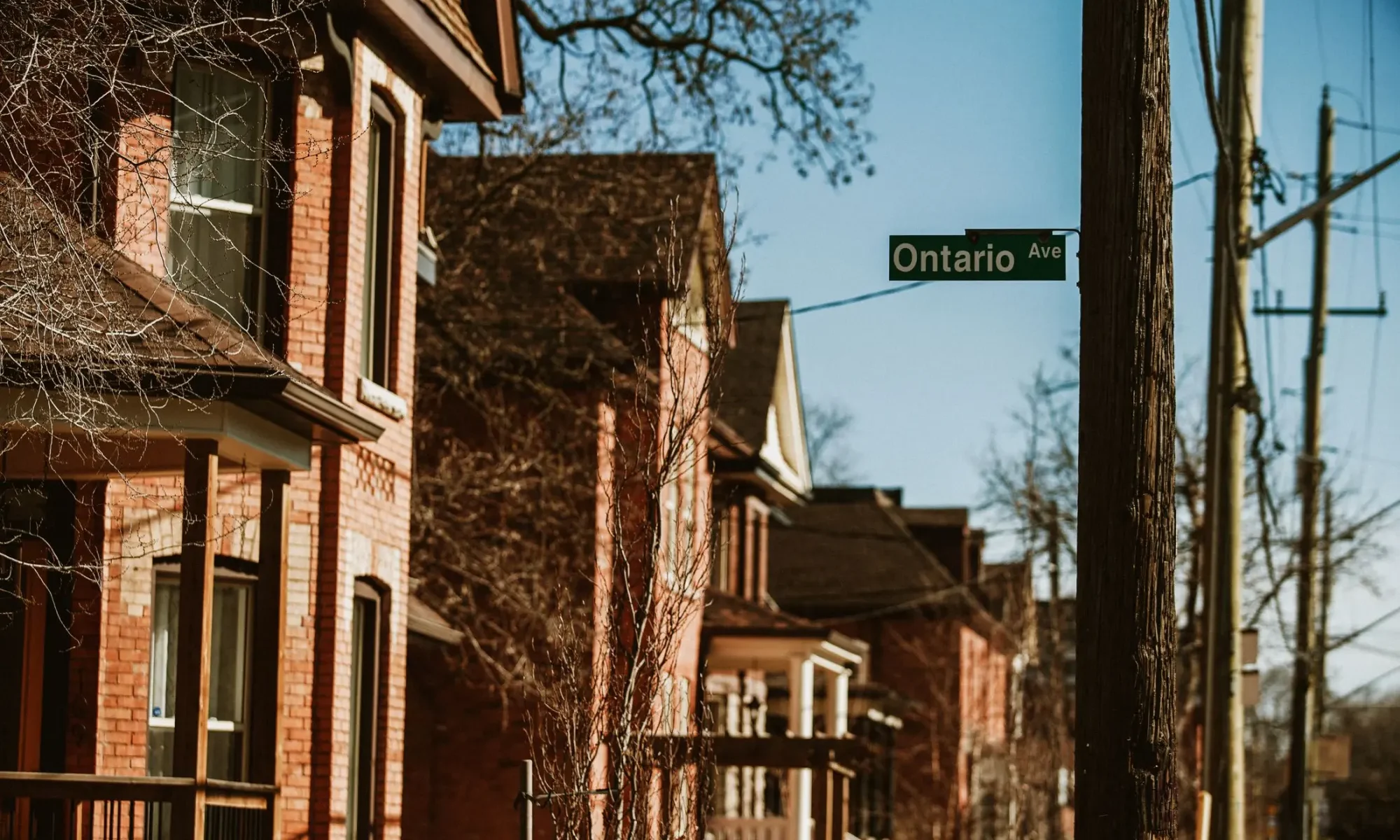 Historic brick homes on a residential street in Hamilton, Ontario