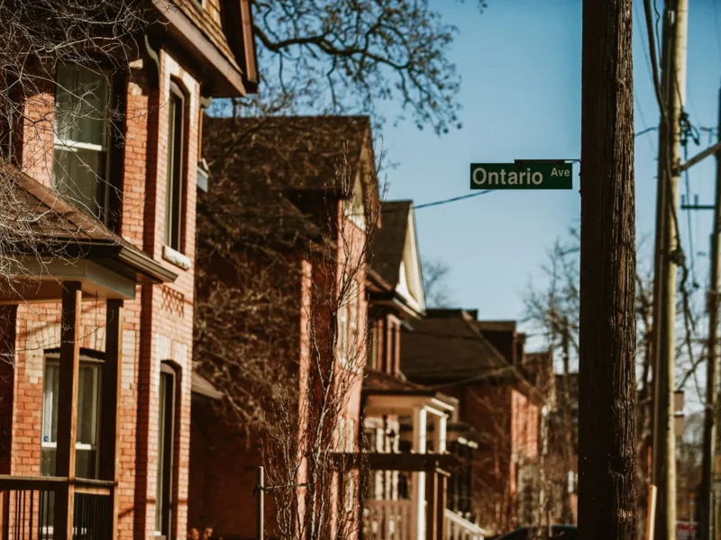 Historic brick homes on a residential street in Hamilton, Ontario
