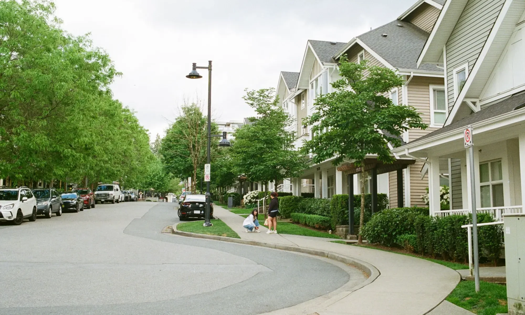Newer homes along a curving street in a growing suburb