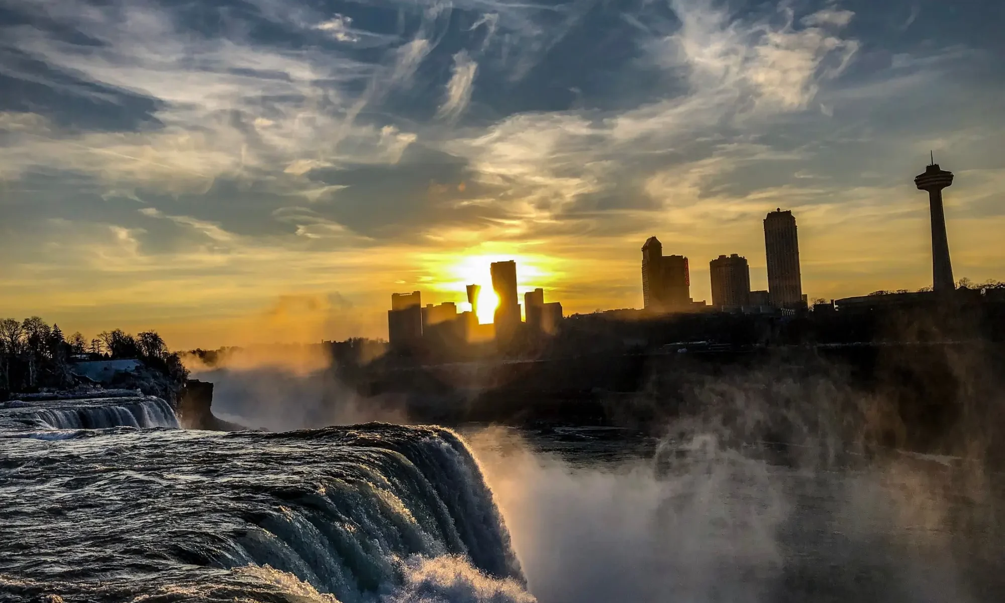 Niagara Falls and the city skyline at sunset