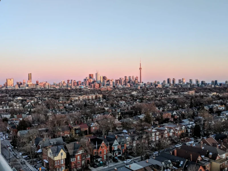 Toronto residential neighbourhood and skyline with the CN Tower at sunset
